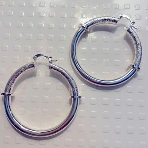 2” Silver Hoops. Never worn. Click close clasp.